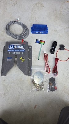 EZ Lock wheelchair lock down device like Qstraint QLock