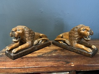 Pair of 19th century folk art carved oak lions