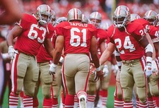 Jesse Sapolu San Francisco 49ers greets his teammates prior to a N- Old Photo