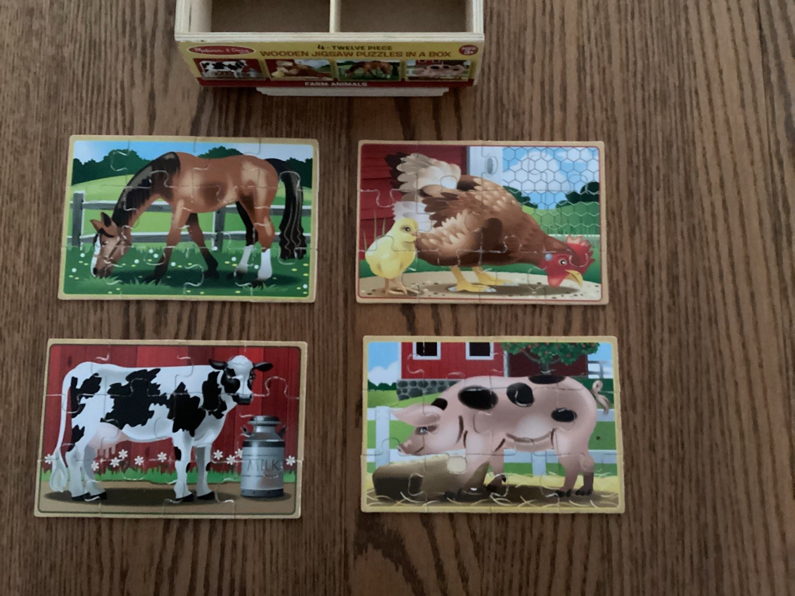 4 Wooden Puzzles in a Box by Melissa and Doug - 4 boxes = 16 puzzles.  Pre owned