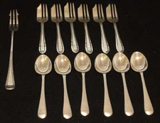 Assortment of 13 pieces vintage silver plate flatware as shown