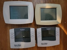 4 used HVAC Thermostats for a professional needing quick backups