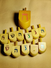 11 Wooden Hannukah Dreidles and 1 Large Wooden Hannukah Dreidle