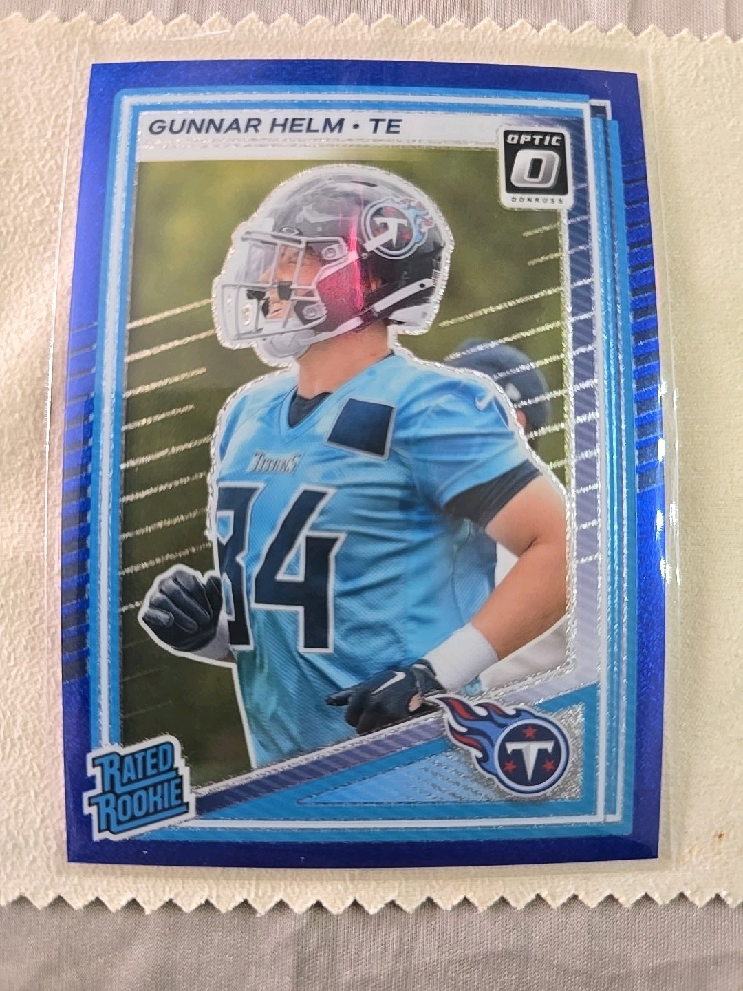 2025 Panini Optic Blue Glitter Gunnar Helm Rated Rookie No. 294 Titans SP