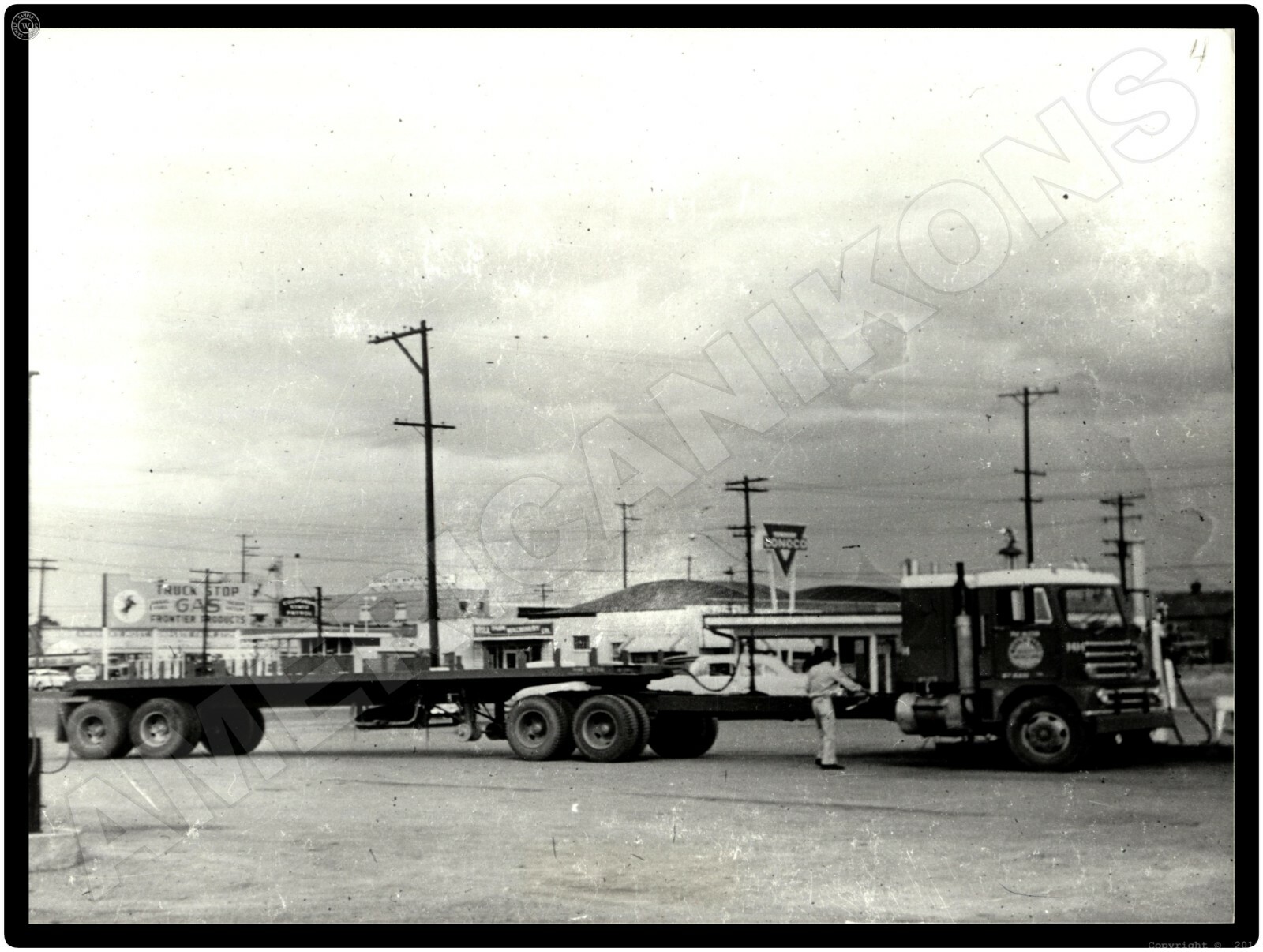 Diamond T Trucks New Metal Sign: Flat Bed Trailer At Conoco Truck Stop, Frontier