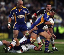 David Furner of Leed Rhinos is tackled by Lee Radford of Bradford - Old Photo