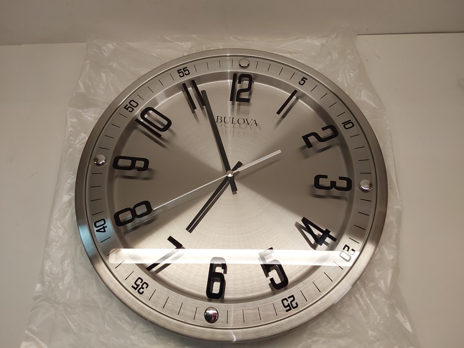 Bulova C4646 Silhouette Wall Clock 16" Diameter, Silver Flush Mounted Glass Dial