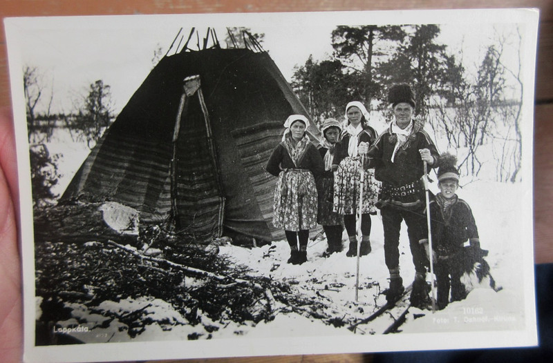 VINTAGE LAPLANDER FAMILY NEAR HUT MAN ON SNOW SKIS REAL PHOTO POSTCARD