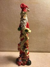 Vintage Tall/Slender 11.5" tall Santa With A Scroll and a bag of toys Figurine