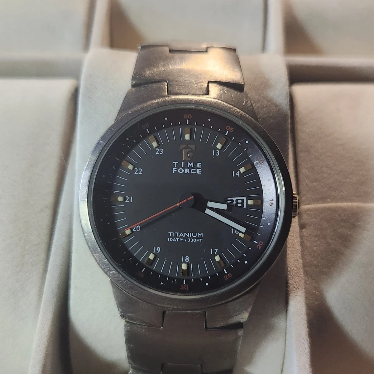 Time Force titanium wristwatch features a 10ATM/330FT water resistance 