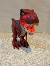 Red T-Rex Dinosaur Toy. Electronic Walking Light Up Sound Figure