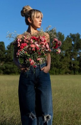 Millie Bobby Brown Standing Field Holding Bunch Flowers 11x17