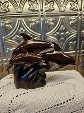 Trio Of Dolfins Riding A Wave, Ironwood Statue