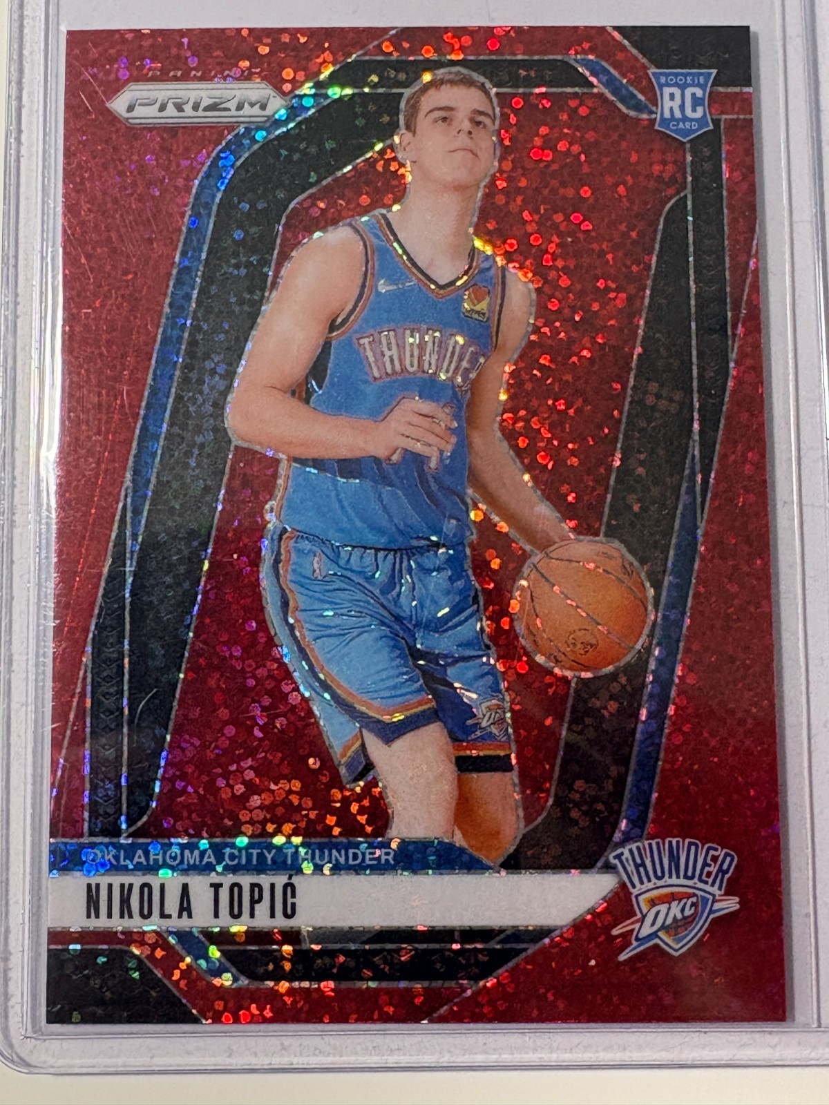 Nikola Topic 2024-25 Panini Prizm Prizms Red Sparkle (RC) #230 OKC Thunder!