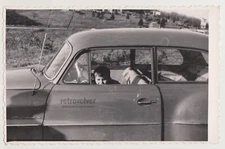 Adorable Little Driver Boy Peek Through the Window, Hand Firm on the Wheel Photo