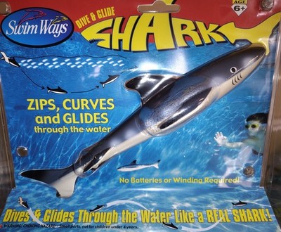 SwimWays Dive 'N Glide Shark, a shark-shaped pool toy designed for underwater...