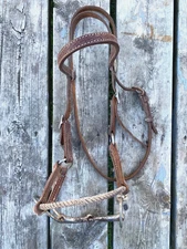 Used Western half breed training side pull w/rope noseband