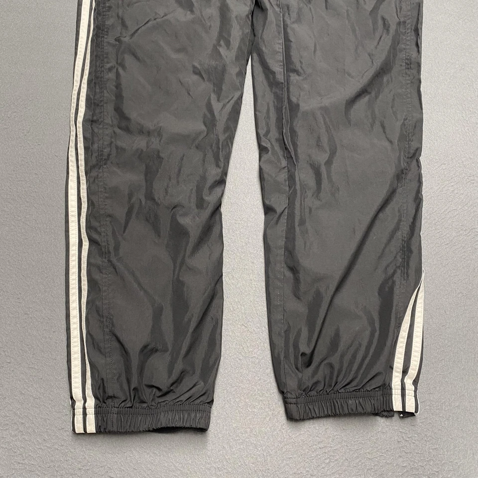 Pantalones Adidas Para Hombre Medianos Negros Calentamiento de Pista 3 Rayas Cremallera Forrados al Tobillo Nylon Foto 4 de 4