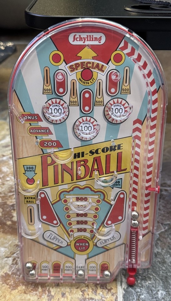 Pocket-sized retro pinball machine that actually works — tactile, nostalgic, and endlessly fidget-able on a desk.