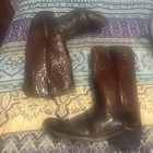 Men’s Acme leather cowboy boots with pointed toes, black heels, and white embroidered Western flame and swirl patterns.