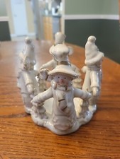 Four Snowman around Candle Holder Christmas Winter