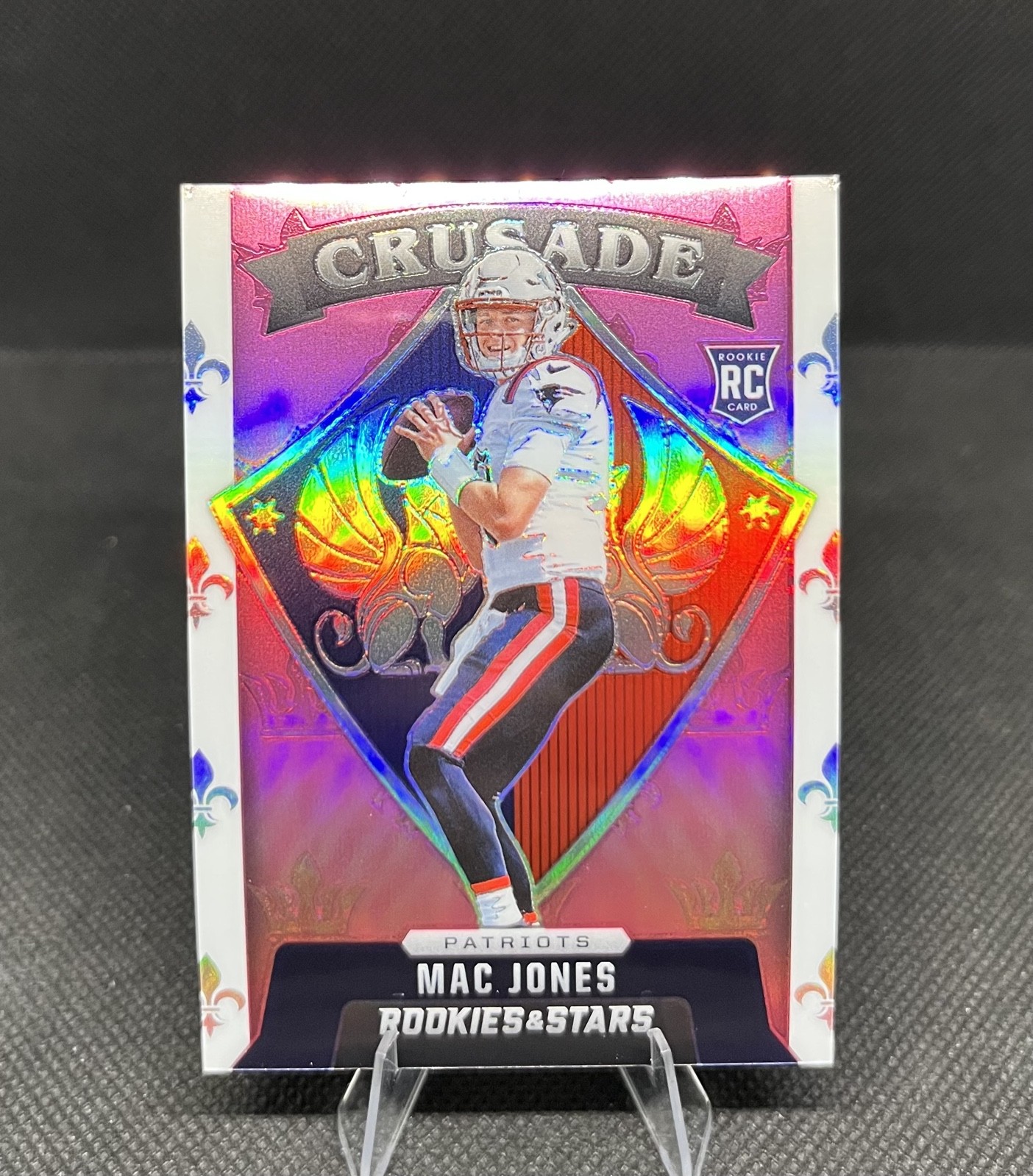 2021 Panini Rookies & Stars - Crusade Mac Jones #CR-24 Pink Prizm /75 (RC)
