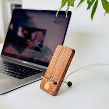 Versatile Wooden Phone Stand: Easy Charging and Viewing with Minimalistic