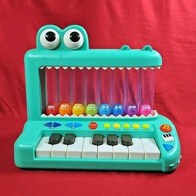 Battat Croco Pop Piano Toy Keyboard with Songs Sounds Lights Baby and Toddler