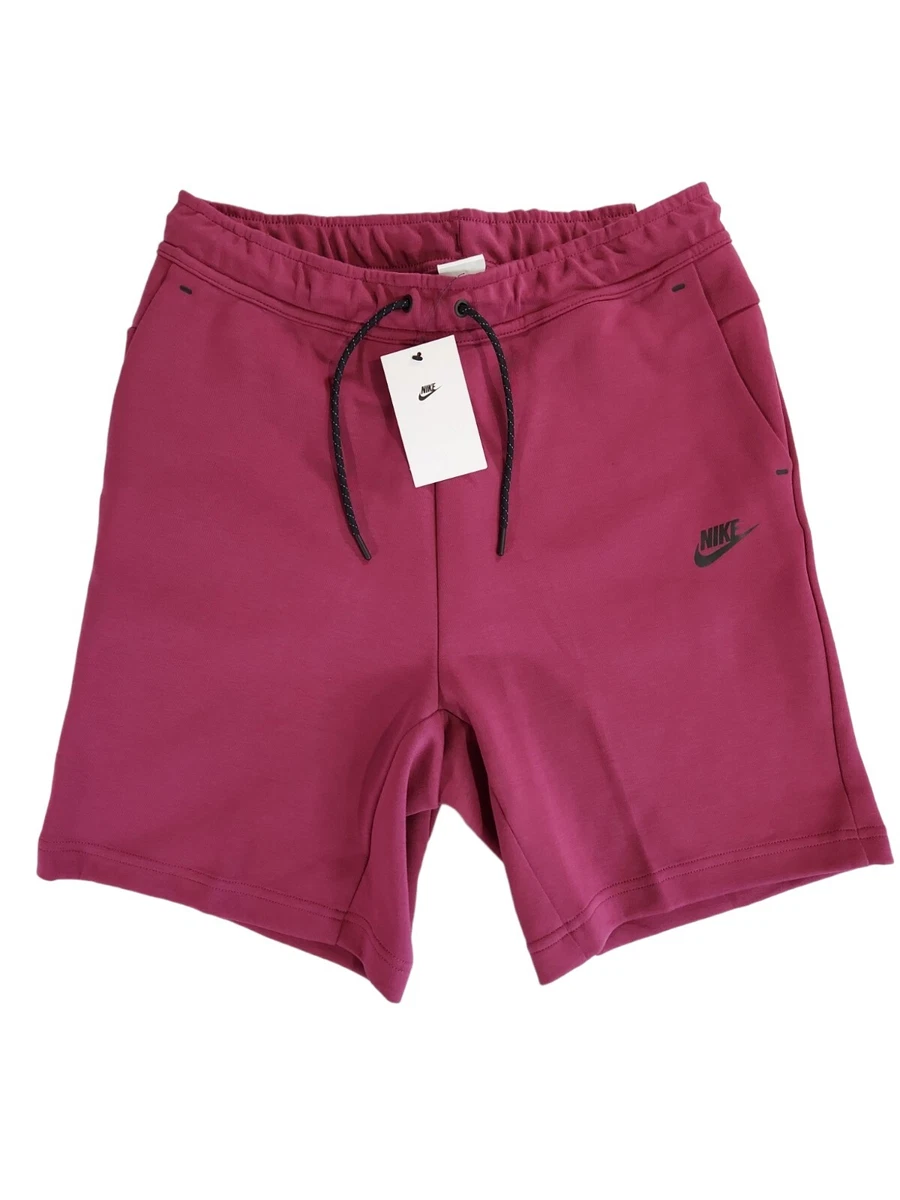 Pink nike tech fleece deals shorts