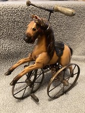 Antique wooden carved toy horse tricycle.