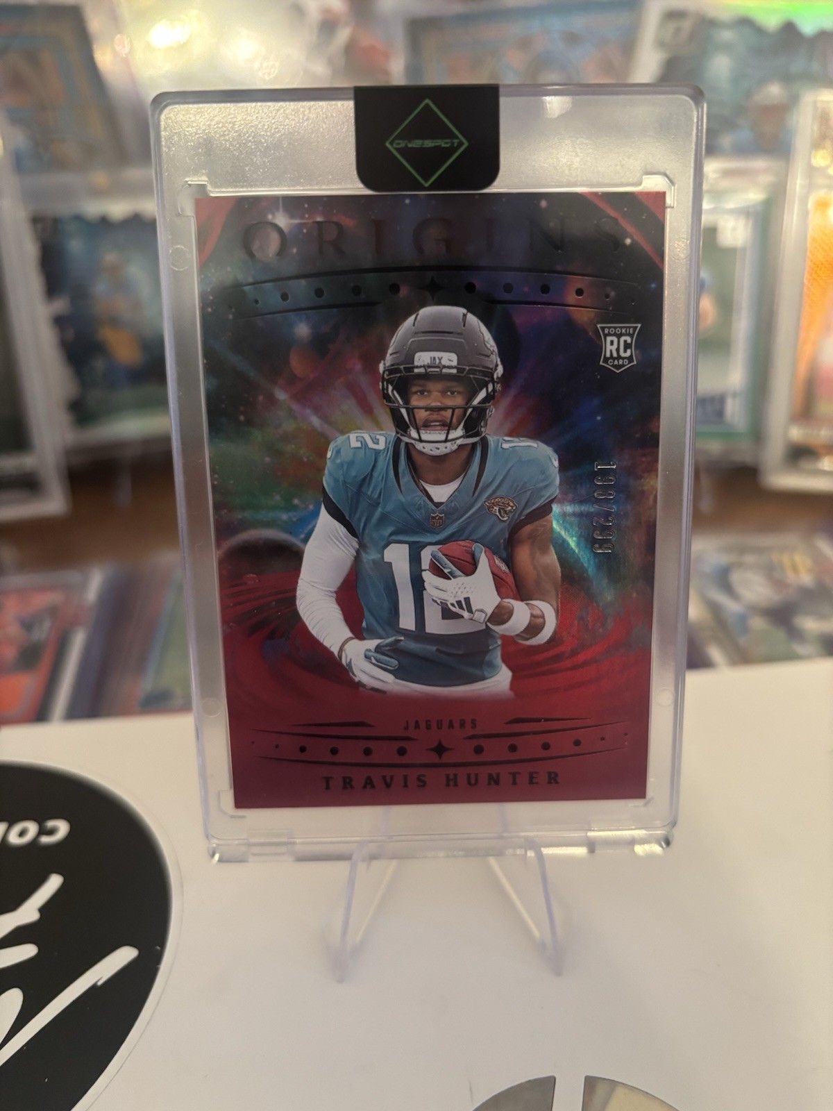 2025 Panini Origins - Rookies Travis Hunter, Travis Hunter #142 Holo Red /299 RC
