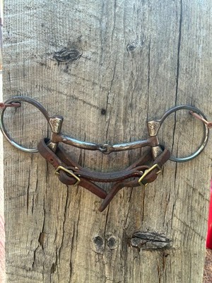 Engraved sterling silver D ring snaffle bit with chin strap and weighted reins