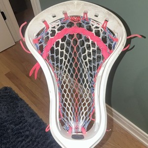 Strung Lacrosse Head White with Pink, Blue, and Black Mesh Stringing