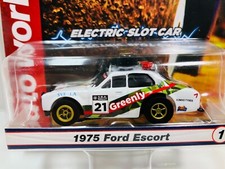 AUTO-WORLD X-TRACTION  1975 FORD ESCORT RALLYE " GREENLY "  NEW Aurora AFX