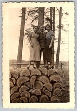 Vtg B&W Snapshot Man & Women In Fashionable Attire Standing On Log Pile 1940s