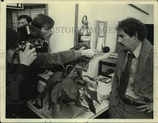 Press Photo Reporters Interview Man at Office - sap36207