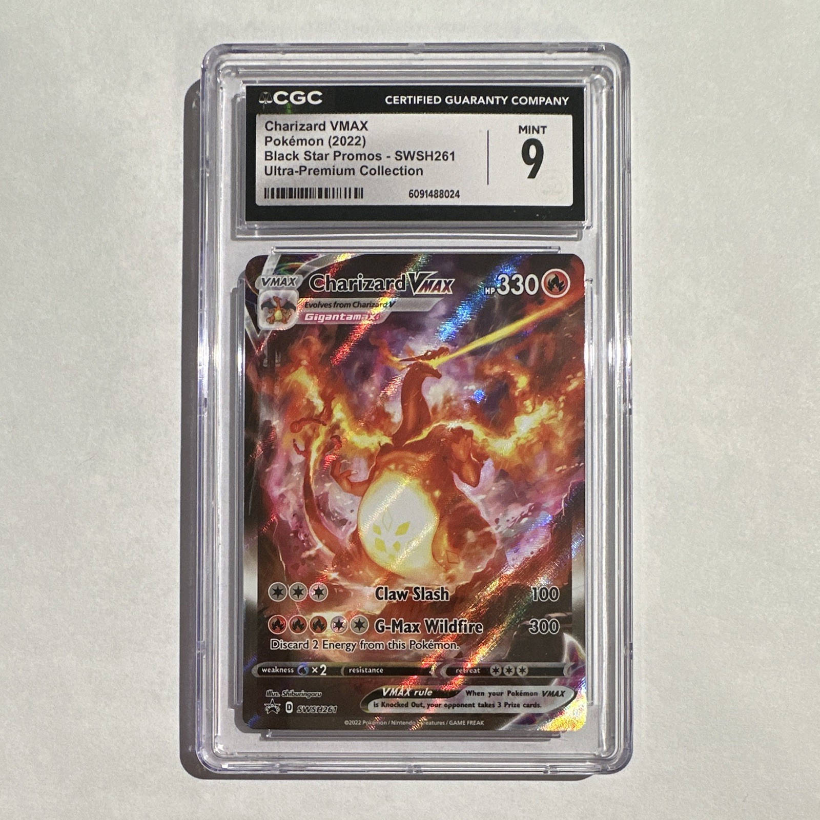 The Pokémon Company 2022 Charizard VMAX Holo Promo SWSH261 CGC 9