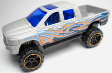 2014 HOT WHEELS DODGE RAM 1500 SILVER 3 1/8" PICKUP TRUCK W/ BLUE ORANGE  BLACK