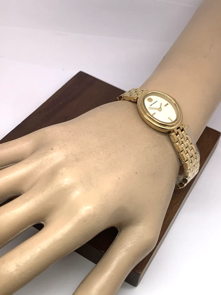 Reloj para mujer Tory Burch TBW6032 cuarzo ovalado esfera crema dorado acero inoxidable Foto 4 de 4