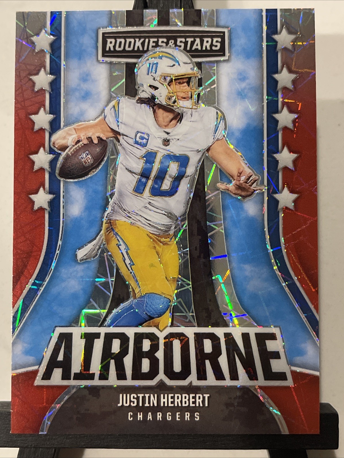 2023 Rookies & Stars Justin Herbert Airborne Longevity Prizm #AI-18