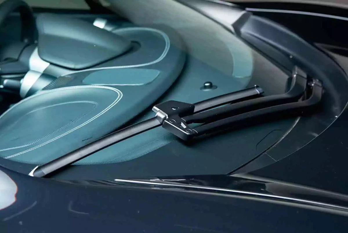 A brand new premium wiper blade on a luxury vehicle.