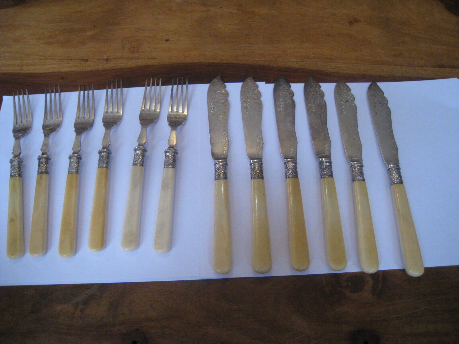 VINTAGE SET OF 12 SILVER PLATED WALKER AND HALL FISH KNIVES AND FORKS