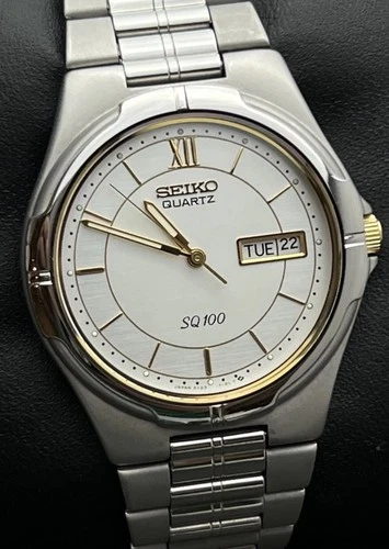 Vintage New 1988 SEIKO SQ100 Men's 38mm Quartz Watch Day Date Steel White 100M