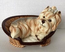 Porcelain Yorkshire Terrier/ Lhaso Apso Dog Figurine in Basket. 6” X 5”.