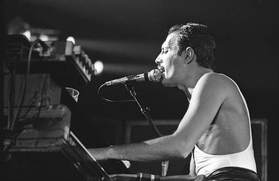 Freddie Mercury singer member of the band Queen during a concert a- Old Photo 36