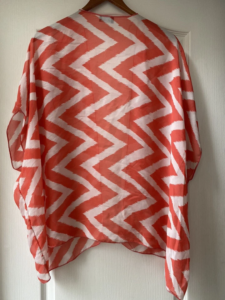 Cubierta de playa/piscina semi transparente Wet Seal Foto 2 de 4