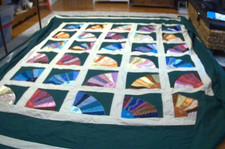 HAND QUILTED GREEN QUILT WITH EMBROIDERED FANS AS CENTER DESIGN 98" BY 87 "