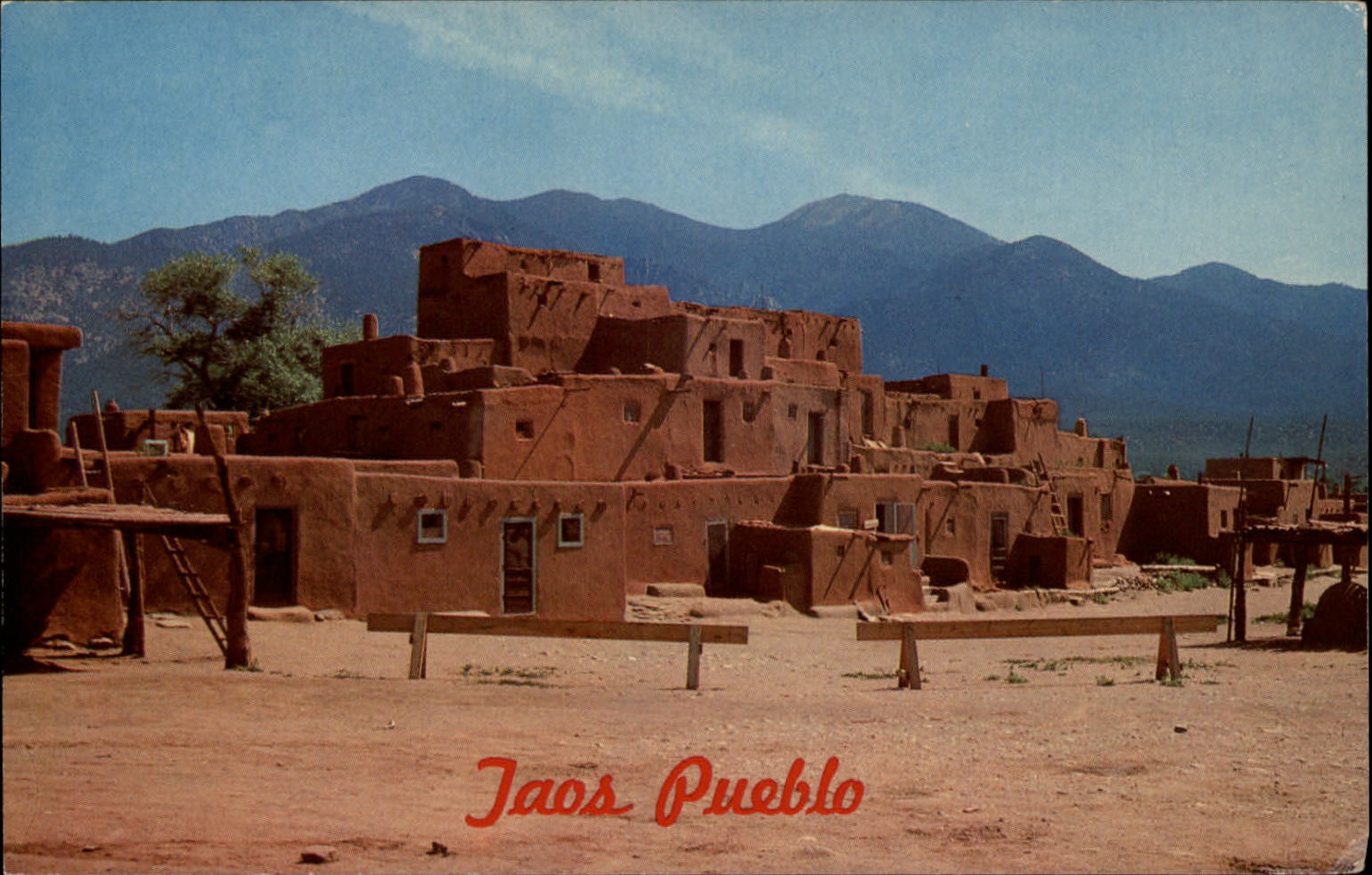 Taos New Mexico Pueblo adobe building ladders hitching posts vintage