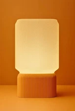 Modern PLA bedside dimmer lamp with warm LED light and custom colors available.