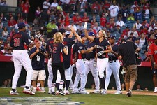 Jennie Finch celebrates after a home run at the Taco Bell All-Star- Old Photo